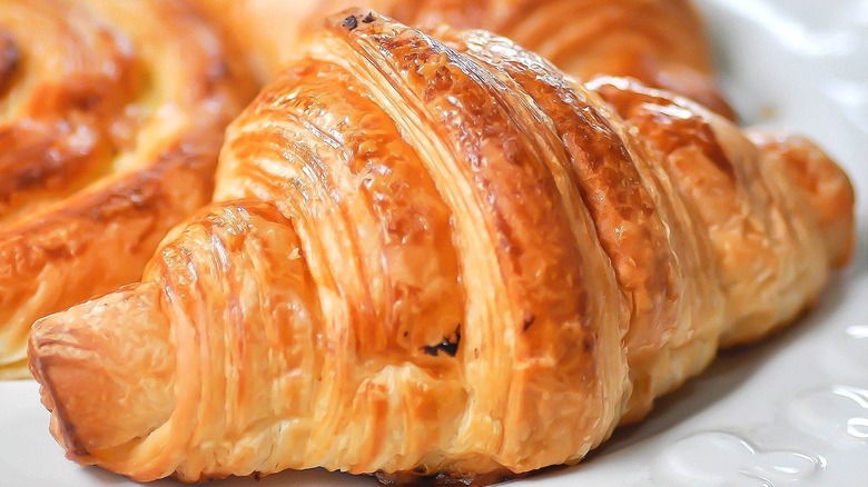 Closeup of croissant breakfast pastries on a white plate