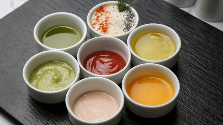 Various sauce options in white bowls