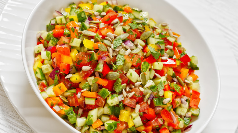 a chopped salad with multi-colored veggies