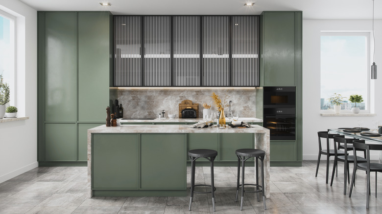Gray green kitchen with an island