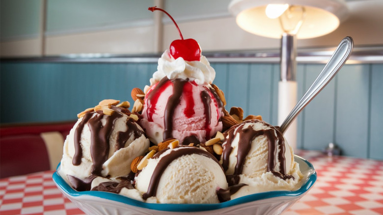 A big ice cream sundae with a cherry on top