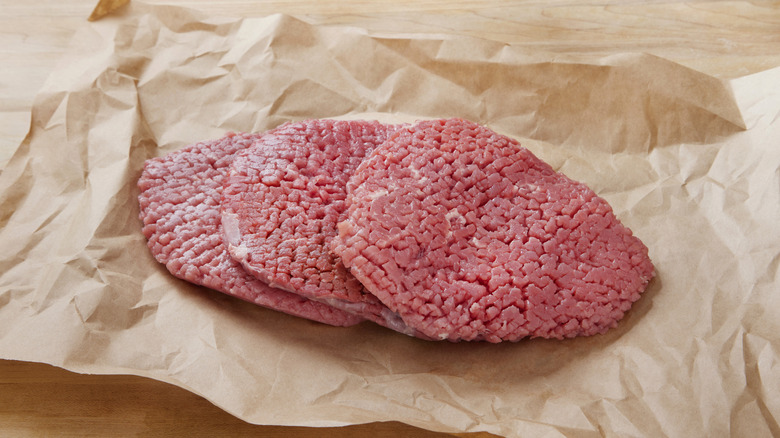 Pieces of mechanically tenderized steak
