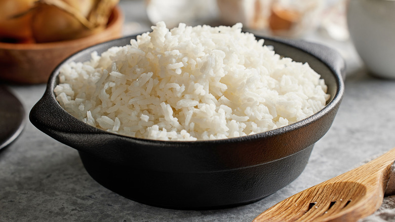 A small crock full of cooked white rice