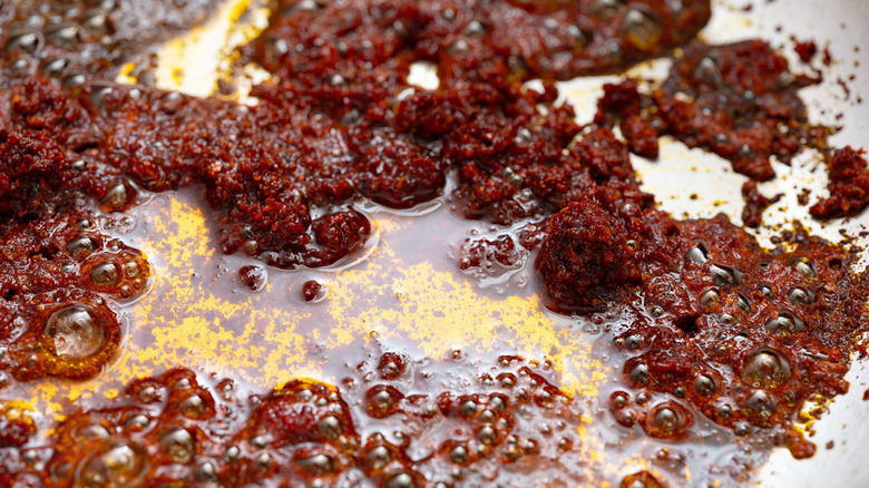 Blooming spices in a pan with oil