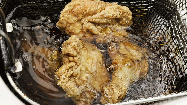 Chicken frying in oil