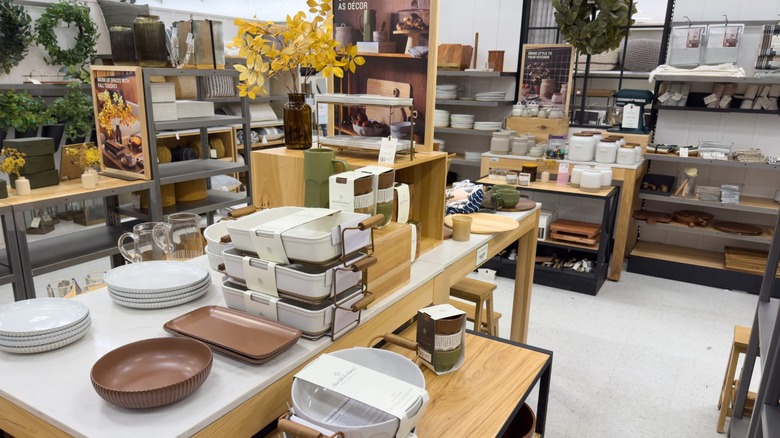 The home goods section inside of a Target store showing stacks of plates and other home items.