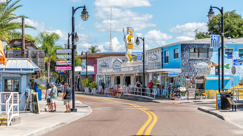 Street view of Tarpon Springs with Greek stores and flags lining the streets