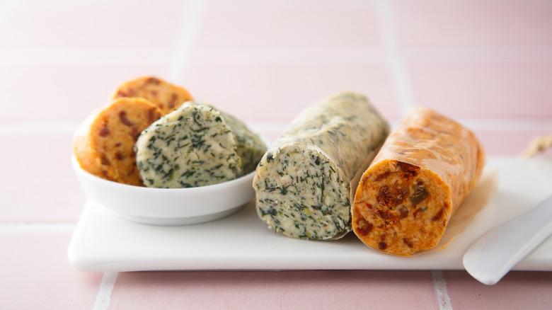 four different compound butter logs