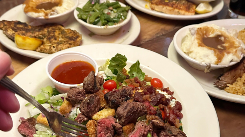 Assortment of meals on a table at Texas Roadhouse