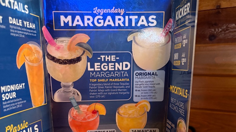 The Texas Roadhouse margarita menu on a wooden table