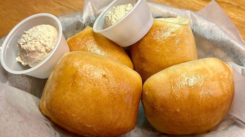 Basket of rolls with cinnamon honey butter at Texas Roadhouse