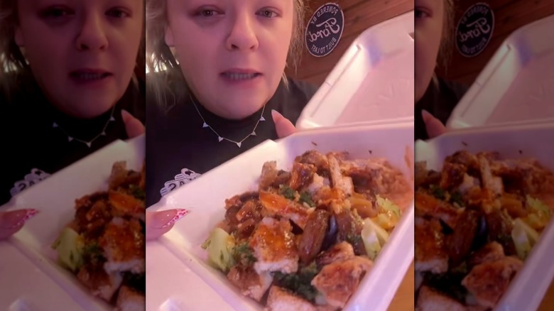Chicken, broccoli, and rice tossed in a takeout container