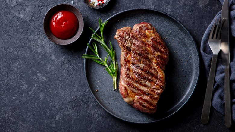 Ribeye steak on dark background