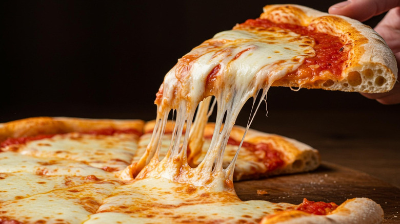 cheese pizza slice being pulled
