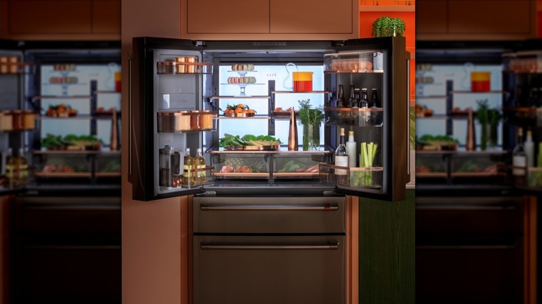 Cafe 28.7 cu. ft. smart 4-door French door refrigerator in a kitchen with fridge doors open