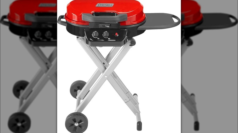 A Coleman grill with collapsable legs