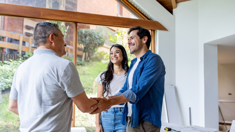 Couple discussing plans with contractor