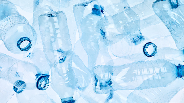 Multiple empty plastic water bottles in a pile