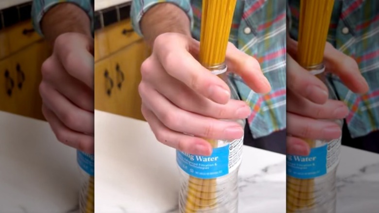 Raw spaghetti wrapped in measuring tape