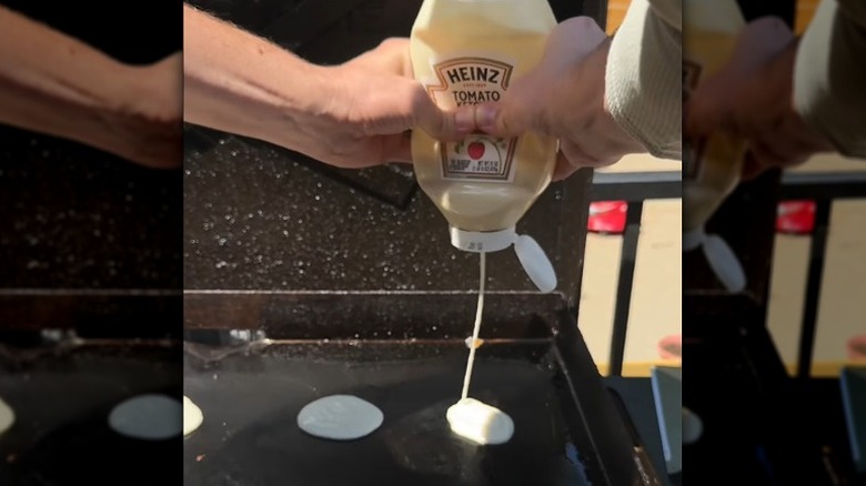 Squeezing pancake batter out of a Heinz ketchup bottle
