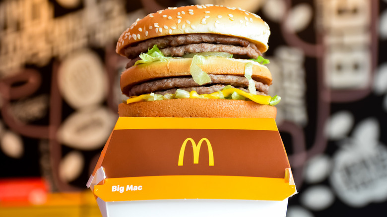 A McDonald's Big Mac on top of a Big Mac container.