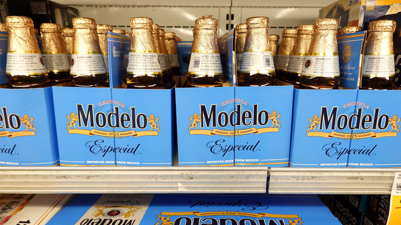 Modelo beer bottles on a shelf in a store