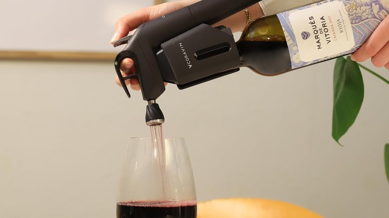 Pouring red wine out of Coravin wine system