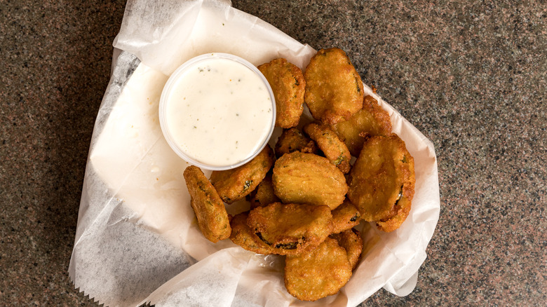 Serving of fried pickles and ranch dressing