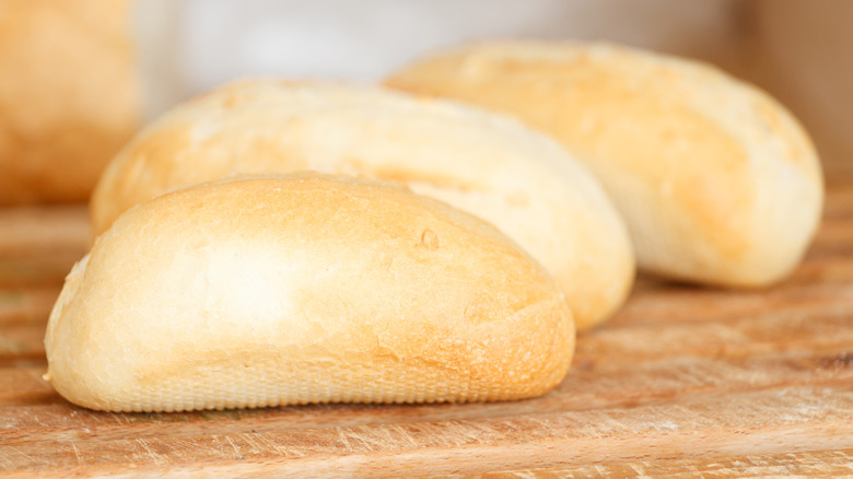 Hoagie rolls on a wooden board