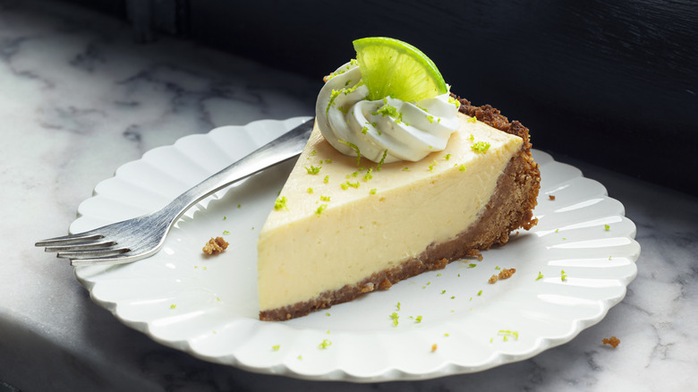 Slice of key lime pie on a plate