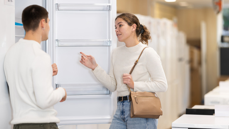 Person talking to someone else at an appliance store