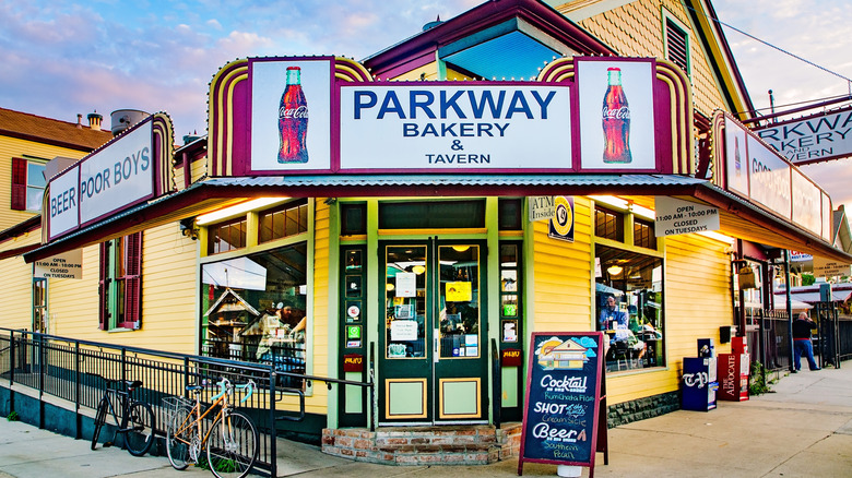 Parkway Bakery & Tavern's charming, weathered facade, featuring a large sign with its name