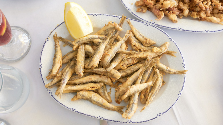 fried anchovies on white plate