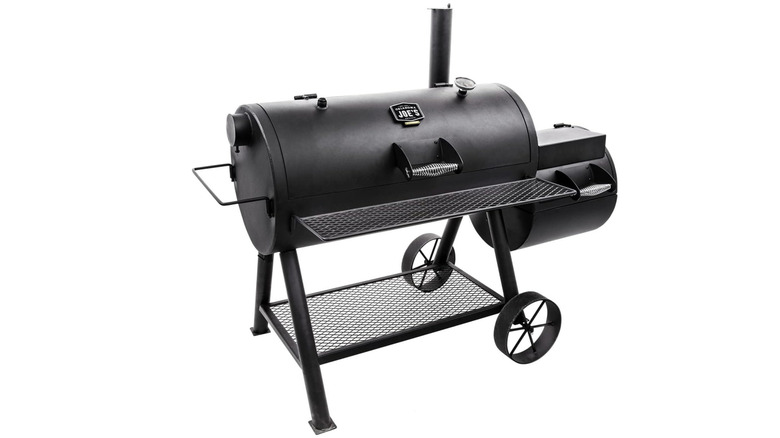 Black barrel smoker with off-set smoker and smokestack