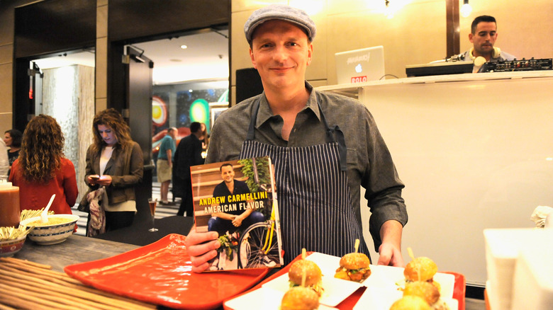 Andrew Carmellini with his cookbook