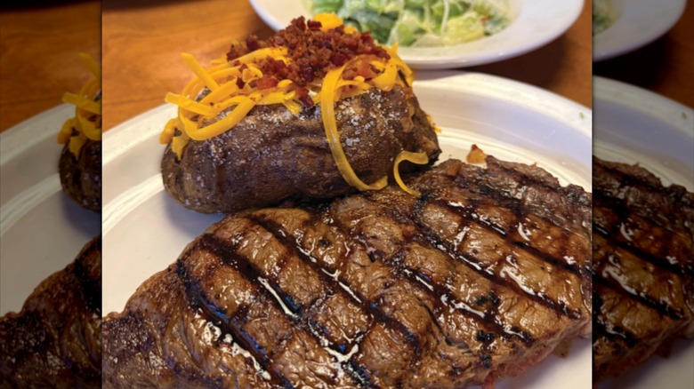 Steak, baked potato, and salad from Texas Roadhouse