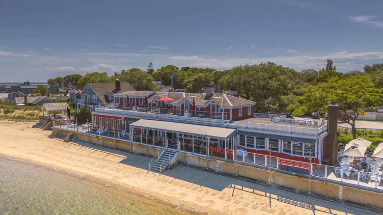 An aerial exterior shot of The Red Inn from over the Atlantic Ocean