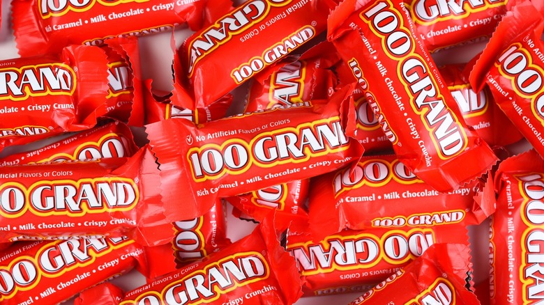 100 grand candy bars in a pile