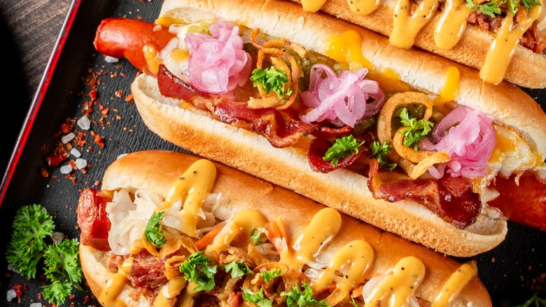 hot dogs with various creative toppings