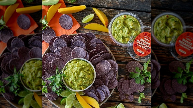 Trader Joe's Spicy Mango Habanero Guacamole with chips on wooden table
