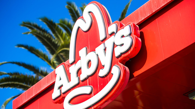 arby's sign and palm tree