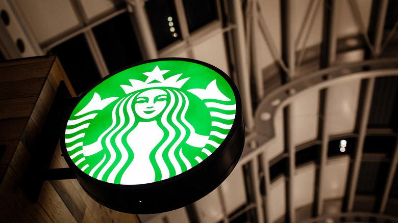 starbucks sign against sky