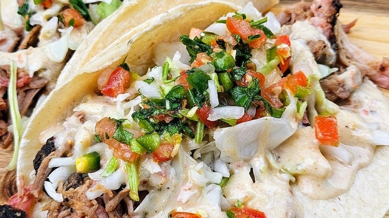 Pulled pork tacos slathered in sauce