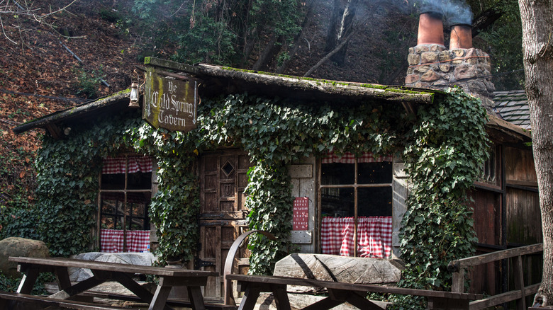 Exterior of Cold Spring Tavern, covered in vines