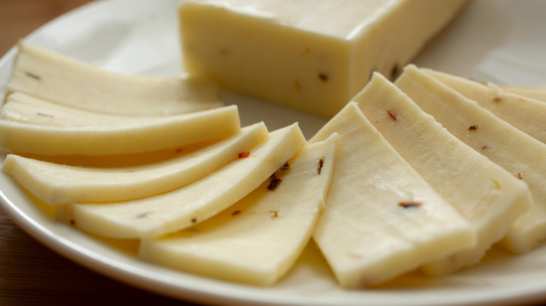 Slices of pepper Jack cheese on a plate