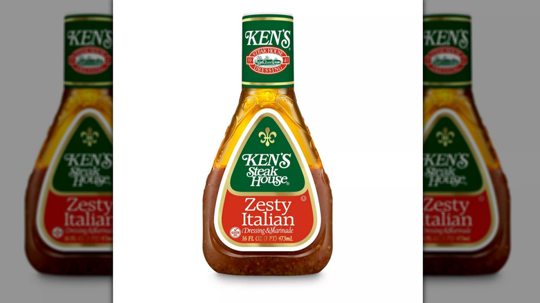 A bottle of Ken's Zesty Italian dressing against a white background