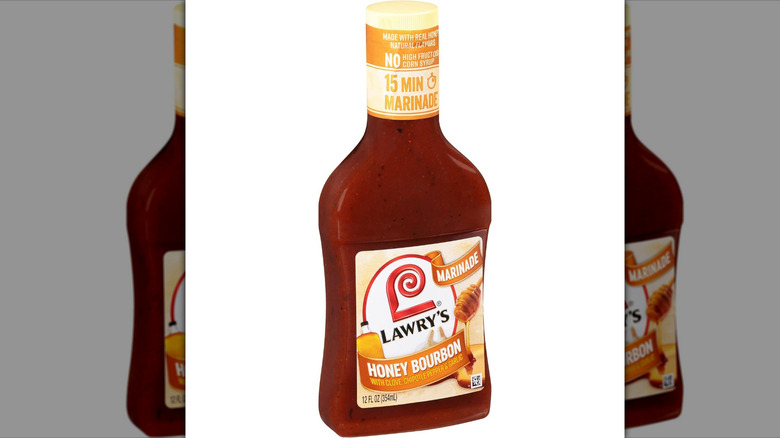 A bottle of Lawry's honey bourbon marinade against a white background