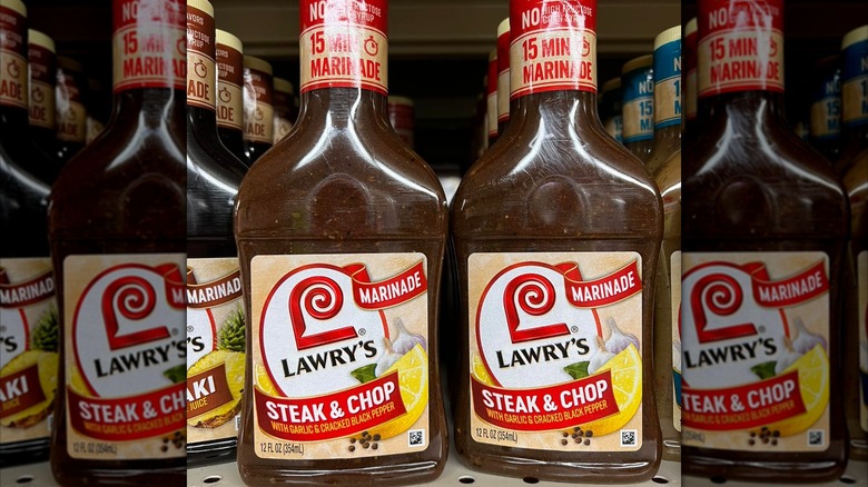 Bottles of Lawry's steak and chop marinade on a grocery store shelf
