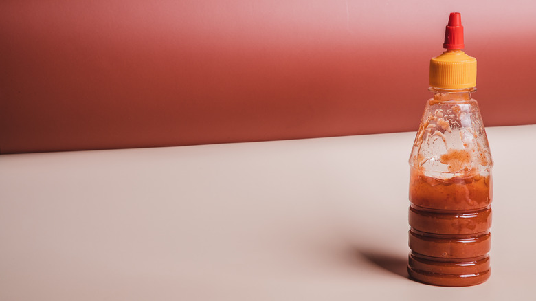 Bottle of hot sauce on a table