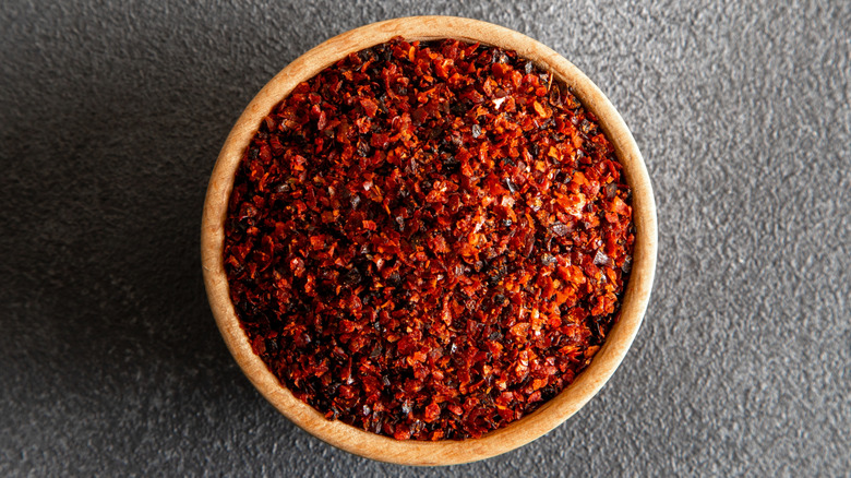 Brown bowl of red pepper flakes